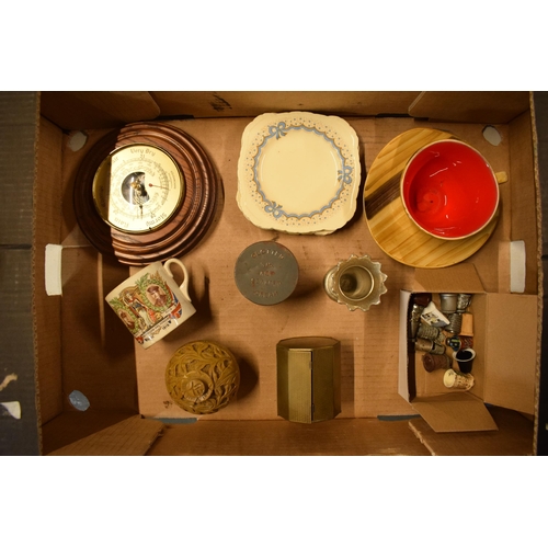 7 - A mixed collection of items to include silver plate, metal tins, a soapstone trinket, thimbles, pict... 