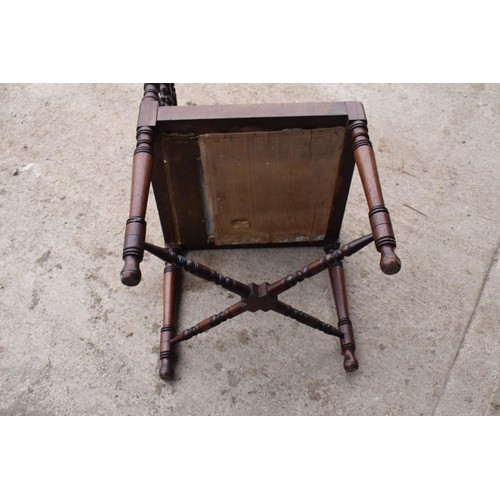 326 - A 19th century Arts and Crafts corner chair with a turned-bobbin back and upholstered seat. 88cm tal... 