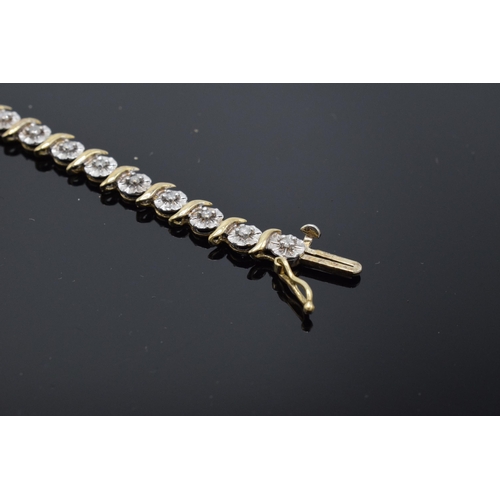 415 - 9ct gold and white gold tennis bracelet with illusion set diamonds. 6.3 grams. 19cm long.