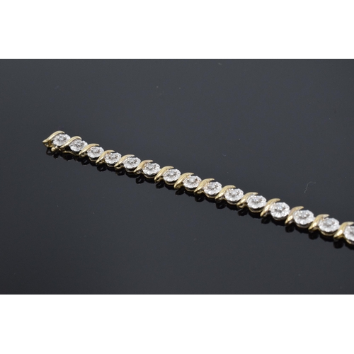 415 - 9ct gold and white gold tennis bracelet with illusion set diamonds. 6.3 grams. 19cm long.