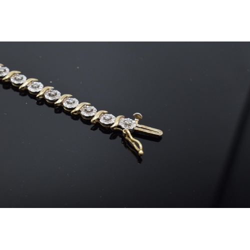 415 - 9ct gold and white gold tennis bracelet with illusion set diamonds. 6.3 grams. 19cm long.