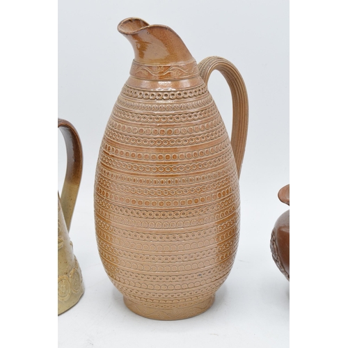 30 - A collection of 19th century stoneware items with traditional scenes to include two-tone examples su... 