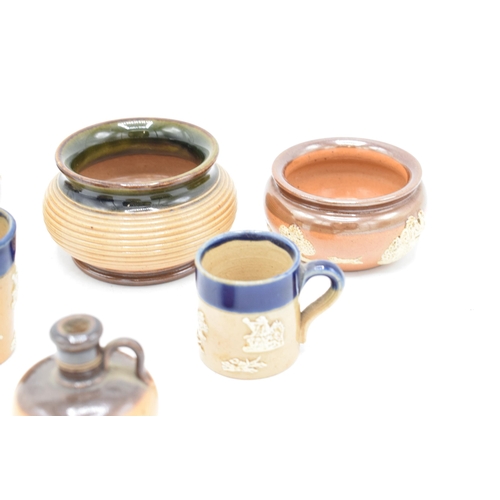 33 - A collection of Royal Doulton stoneware miniatures to include a flagon, blue beaker, blue tankard an... 