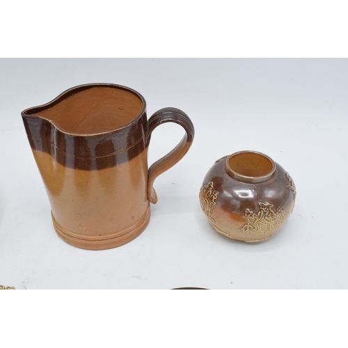 34 - A collection of mainly two-tone stoneware to include a Doulton Lambeth jug for E. Johnson & Co Alnwi... 