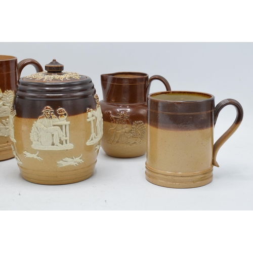 36 - A collection of Royal Doulton and Doulton Lambeth stoneware to include a tobacco jar, a tankard and ... 