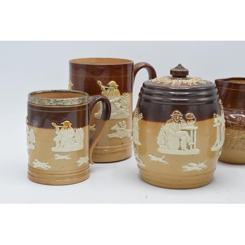 36 - A collection of Royal Doulton and Doulton Lambeth stoneware to include a tobacco jar, a tankard and ... 