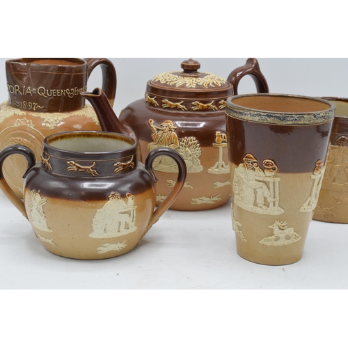 38 - A collection of stoneware to include Doulton Lambeth Queen Victoria 60th Anniversary jug, a silver-r... 