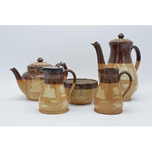 39 - A collection of stoneware depicting traditional country scenes to include a Doulton Lambeth teapot, ... 