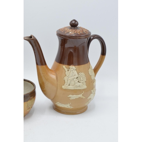 39 - A collection of stoneware depicting traditional country scenes to include a Doulton Lambeth teapot, ... 