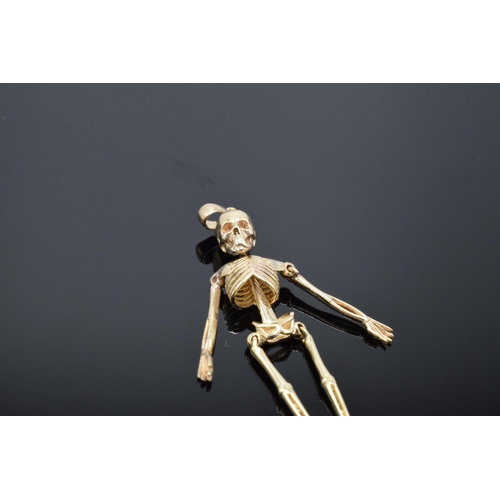 417 - 9ct gold pendant in the form of an anatomical skeleton. 2.4 grams. 4.5cm tall.