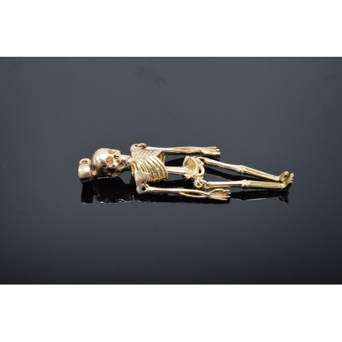 417 - 9ct gold pendant in the form of an anatomical skeleton. 2.4 grams. 4.5cm tall.