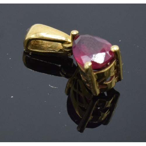 418 - 9ct gold pendant set with ruby or similar stone. 0.8 grams.