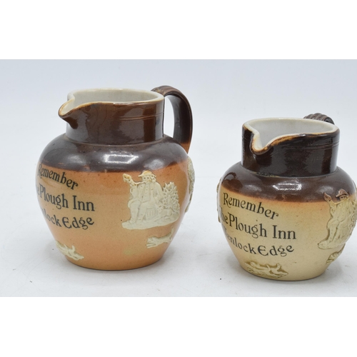 44 - A trio of Royal Doulton graduated stoneware jugs 'Remember The Plough Inn Wenlock Edge' (3). Largest... 