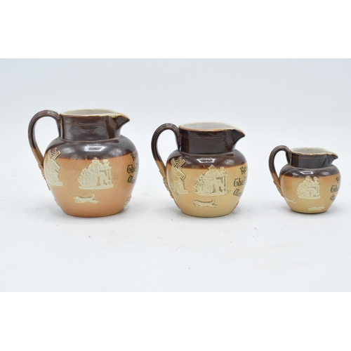 44 - A trio of Royal Doulton graduated stoneware jugs 'Remember The Plough Inn Wenlock Edge' (3). Largest... 