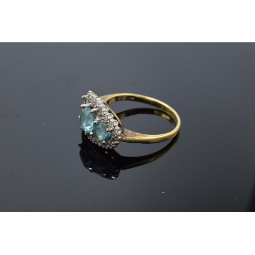 442 - An 18ct gold ring with illusion set diamonds and aqua marines (4.7 grams gross weight) (or similar) ... 