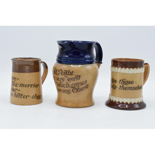 45 - A pair of Doulton Lambeth motto jugs to include 'Heaven helps those who help themselves', 'the more ... 