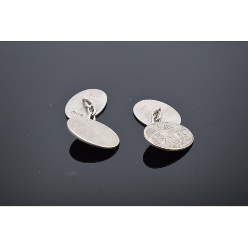 453 - A pair of silver cufflinks. 6.5 grams.