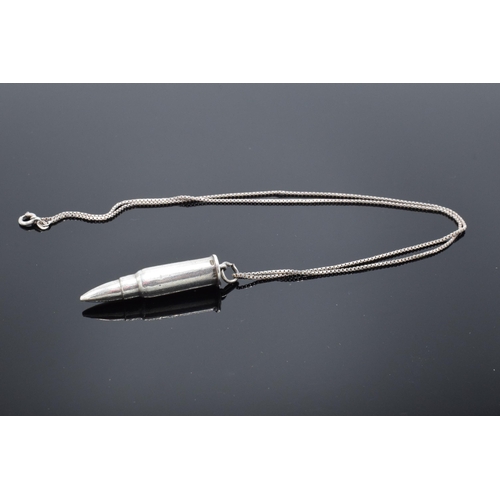 455 - A silver bullet pendant on a silver chain. 45cm length of chain.