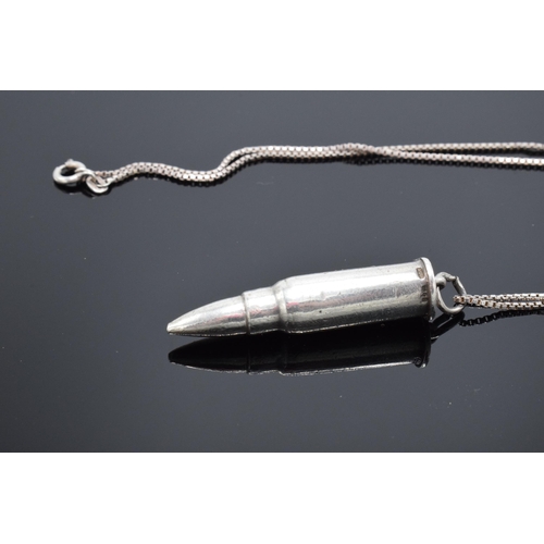 455 - A silver bullet pendant on a silver chain. 45cm length of chain.