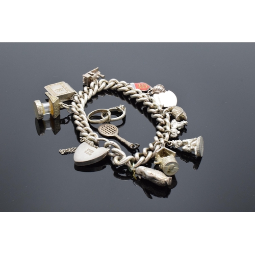 458 - A silver charm bracelet with a few extra charms. 63.3 grams.