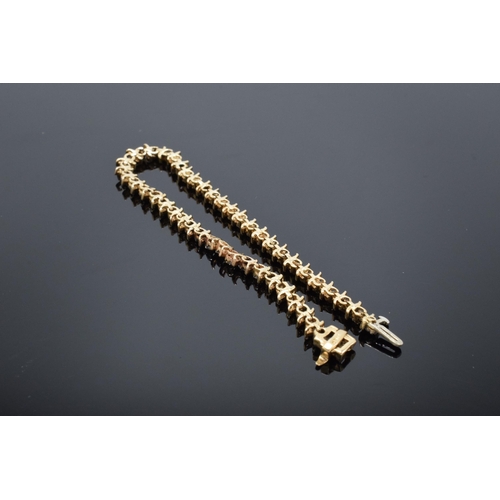 459 - 14k gold and diamond tennis bracelet. Approx 0.5 carats of diamond in approx 46 stones. Length 18.5c... 