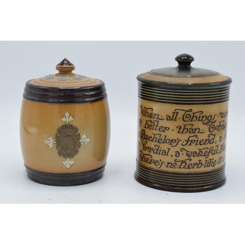 46 - A pair of Doulton Lambeth tobacco jars, one with 'Tobacco' to the front and another with a motto 'wh... 