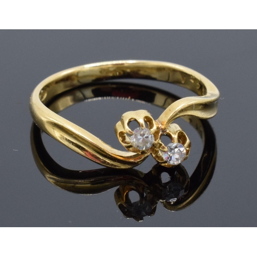 461 - 18ct gold and 2 stone diamond swirl ring. Approx 0.1 carat. UK size N/O. 2.8 grams.