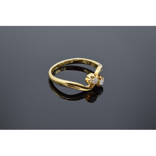 461 - 18ct gold and 2 stone diamond swirl ring. Approx 0.1 carat. UK size N/O. 2.8 grams.