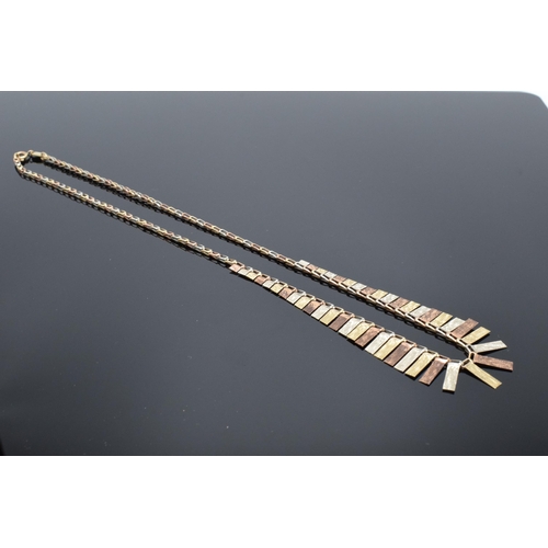 464 - 9ct tri-colour gold fringe necklace, made in Italy with UK import marks. 7.4 grams. 43cm long.