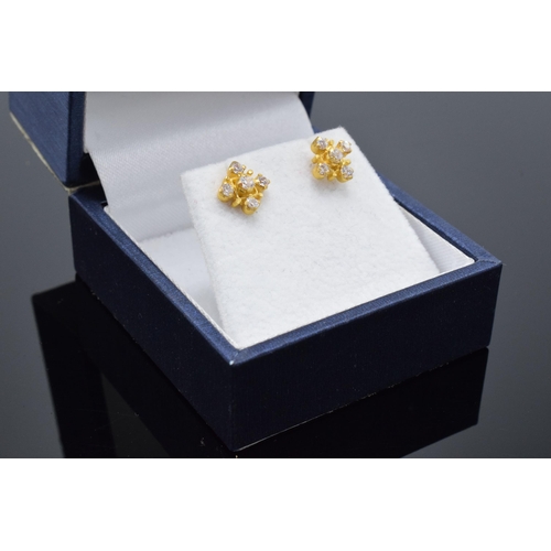 467 - A pair of 22ct gold and CZ stone earrings. 1.9 grams.