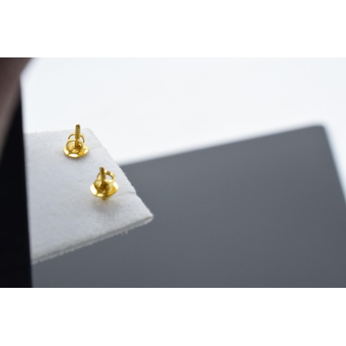 467 - A pair of 22ct gold and CZ stone earrings. 1.9 grams.