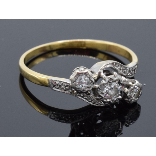 469 - 18ct gold and platinum swirl ring set with 3 illusion-set diamonds. 2.6 grams. 17 points. UK size Q.... 