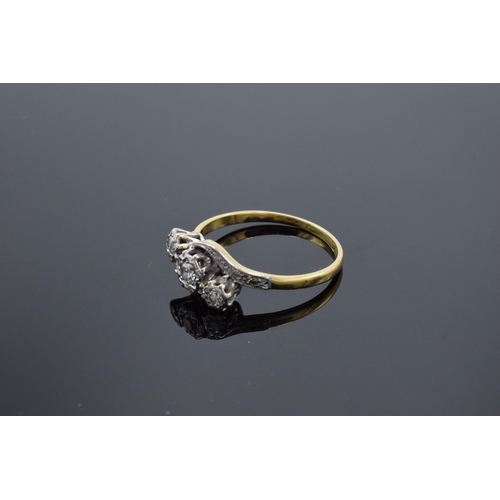 469 - 18ct gold and platinum swirl ring set with 3 illusion-set diamonds. 2.6 grams. 17 points. UK size Q.... 