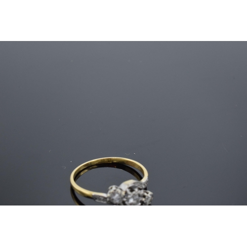 469 - 18ct gold and platinum swirl ring set with 3 illusion-set diamonds. 2.6 grams. 17 points. UK size Q.... 