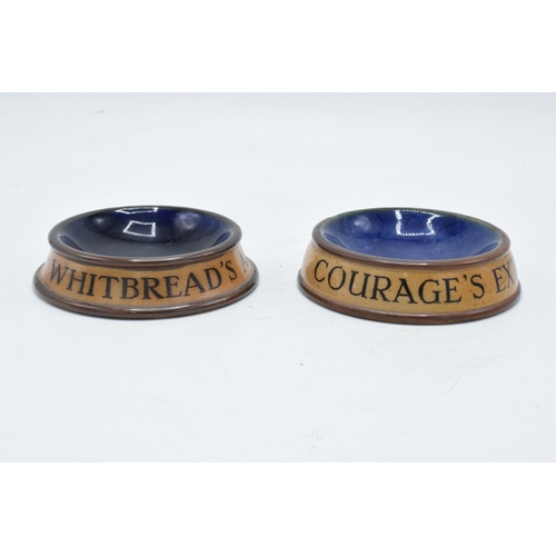 48 - A pair of Royal Doulton stoneware advertising ash trays to include Whitbread's Ale and Stout togethe... 