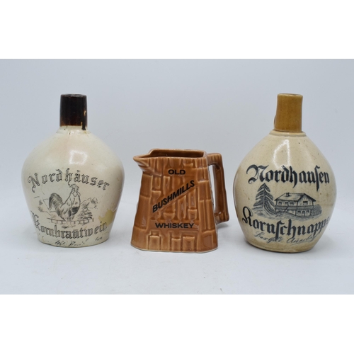 50 - A pair of stoneware flagons to include a Nordhausen Kornschnapps example and a Nordhauser Kornbranti... 