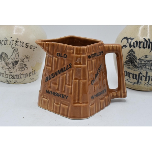 50 - A pair of stoneware flagons to include a Nordhausen Kornschnapps example and a Nordhauser Kornbranti... 