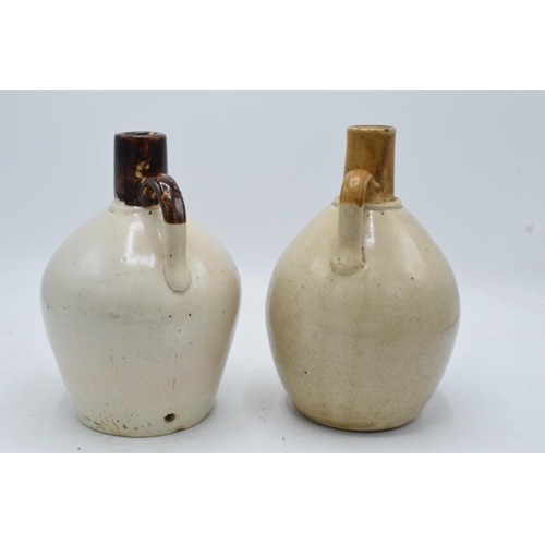 50 - A pair of stoneware flagons to include a Nordhausen Kornschnapps example and a Nordhauser Kornbranti... 