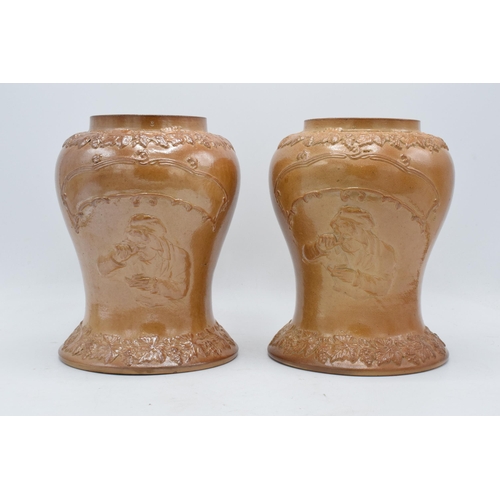 54 - An unusual pair of 19th century salt glazed stoneware baluster shaped snuff jars depicting a figure ... 