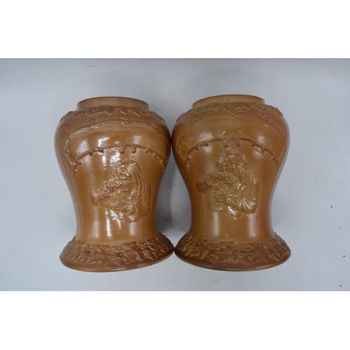 54 - An unusual pair of 19th century salt glazed stoneware baluster shaped snuff jars depicting a figure ... 