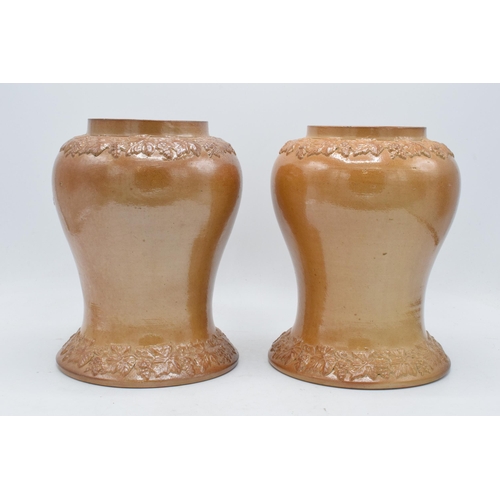 54 - An unusual pair of 19th century salt glazed stoneware baluster shaped snuff jars depicting a figure ... 