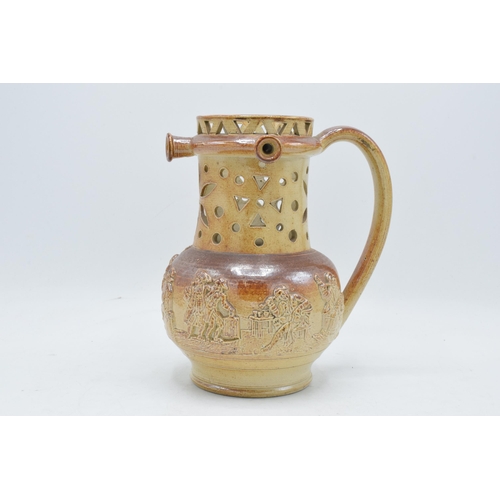 55 - A 19th century Nottingham brown stoneware puzzle jug of traditional form with pierced decoration wit... 