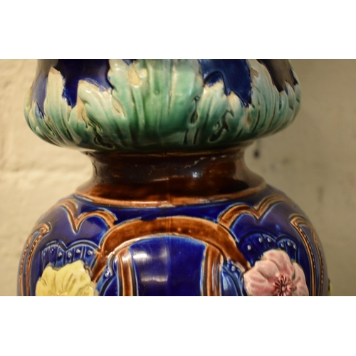 57 - A 19th century majolica jardinière bowl and stand with foliage on a blue background in an Art-Nouvea... 