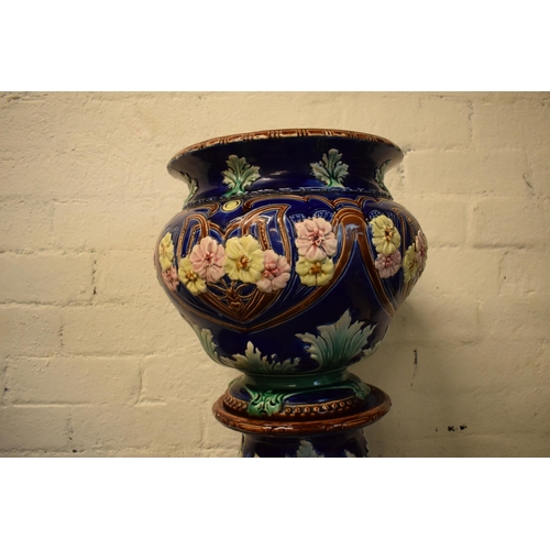 57 - A 19th century majolica jardinière bowl and stand with foliage on a blue background in an Art-Nouvea... 