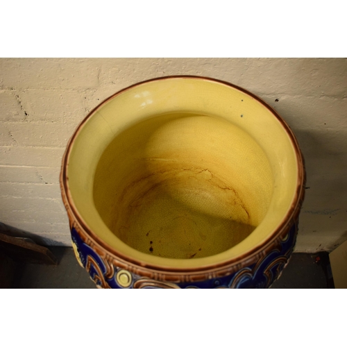 57 - A 19th century majolica jardinière bowl and stand with foliage on a blue background in an Art-Nouvea... 