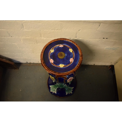 57 - A 19th century majolica jardinière bowl and stand with foliage on a blue background in an Art-Nouvea... 