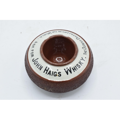 64 - An advertising match striker and holder for John Haig's Whisky. Generally in good condition with som... 