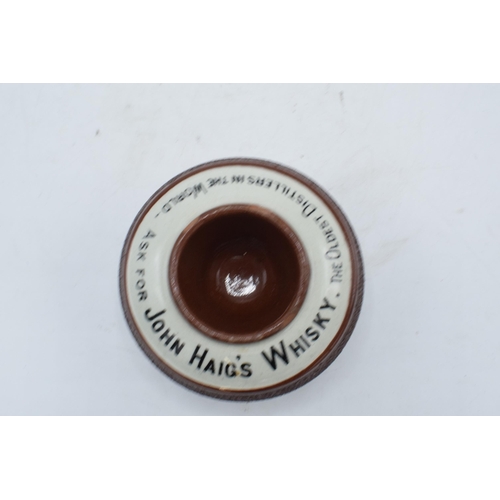 64 - An advertising match striker and holder for John Haig's Whisky. Generally in good condition with som... 