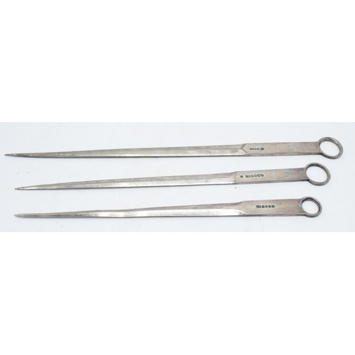 225P - A trio of silver-plated meat skewers (3). Longest 35cm.