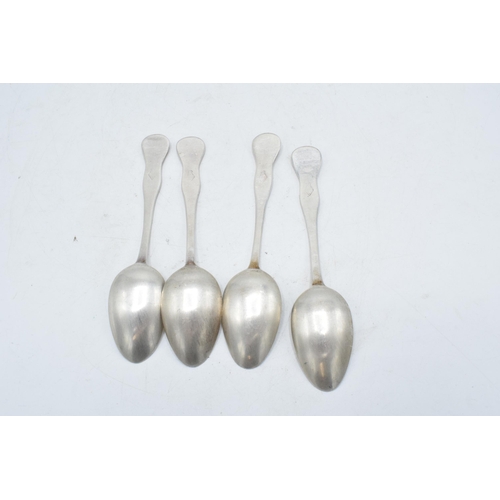 225S - A set of 4 matching white metal tea spoons with unusual pattern to handle (4). 13cm tall.